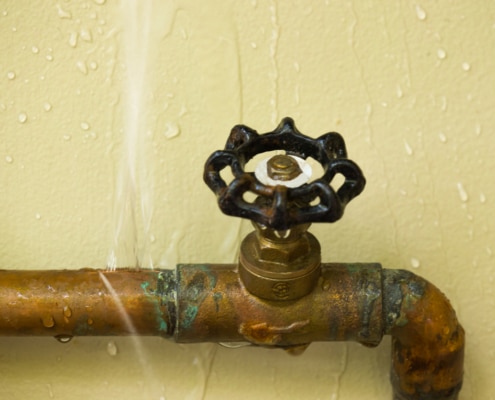 water streams from burst pipes after freezing
